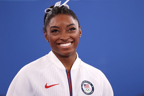 Which sport does Simone Biles compete in?