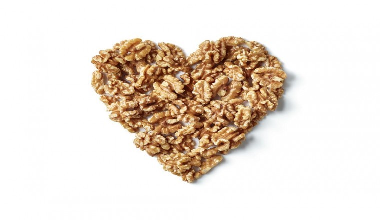 Study links eating just half a serving a day of nuts, such as walnuts, to a decreased risk of cardiovascular disease (CVD)